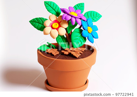 Bright plasticine flower with green leaves in flower pot 97722941