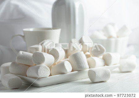 White marshmallows on a wooden table. 97723072