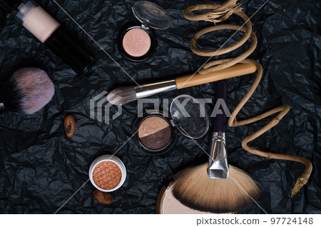set of cosmetics and nature chocolate on black background set of cosmetics and nature chocolate on black background 97724148
