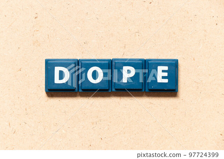 Tile letter in english word dope on wood background Tile letter in english word dope on wood background 97724399