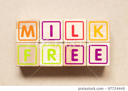 Color letter block in word milk free on wood background Color letter block in word milk free on wood background 97724448