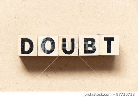 Alphabet letter block in word doubt on wood background Alphabet letter block in word doubt on wood background 97726738