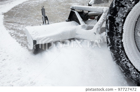 Clearing the road from the snow. 97727472