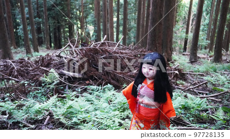 Japanese doll standing in the forest (test of courage) 97728135
