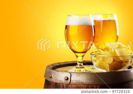 Beer glasses on wooden barrel 97728328