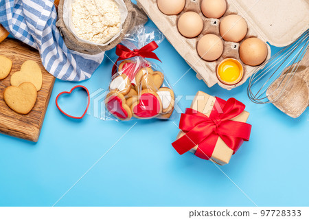 Cooking gingerbread heart cookies for Valentines day Cooking gingerbread heart cookies for Valentines day 97728333