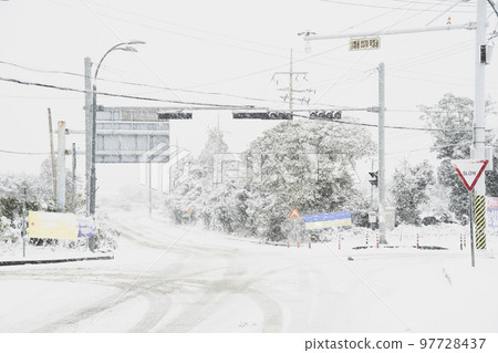 South Korea Jeju Island snow and road scenery 97728437