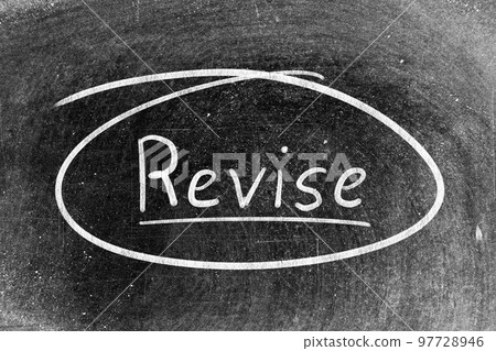 White chalk hand writing in word revise on blackboard background White chalk hand writing in word revise on blackboard background 97728946