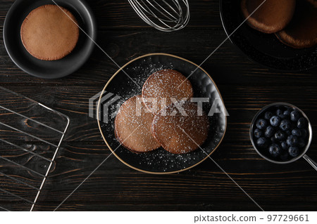 Concept of sweet food, chocolate pancakes, top view Concept of sweet food, chocolate pancakes, top view 97729661