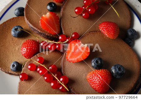 Concept of sweet food, chocolate pancakes, close up 97729664