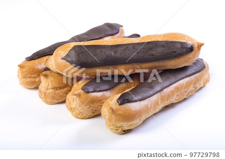 Chocolate eclairs on a white background. Sweet dessert 97729798