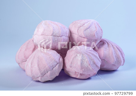 Pink zephyr or marshmallow on a blue background 97729799
