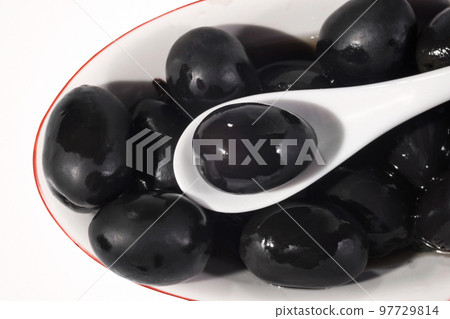Plate of olives close, on a white background 97729814
