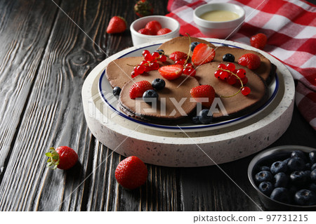 Concept of sweet food, chocolate pancakes, space for text Concept of sweet food, chocolate pancakes, space for text 97731215