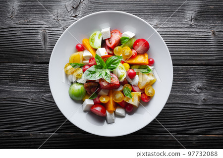 Salad with different varieties kind of tomatoes Salad with different varieties kind of tomatoes 97732088