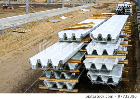 Stack of new corrugated steel roof sheets for steel framework building roofing Stack of new corrugated steel roof sheets for steel framework building roofing 97732386