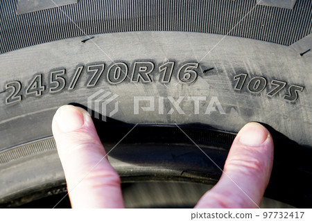 Side view of tire with tire width, height and wheel diameter designations, speed and load indices Side view of tire with tire width, height and wheel diameter designations, speed and load indices 97732417