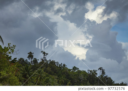 Gray clouds over the rainforest of Raja Ampat archipelago, Indonesia Gray clouds over the rainforest of Raja Ampat archipelago, Indonesia 97732576