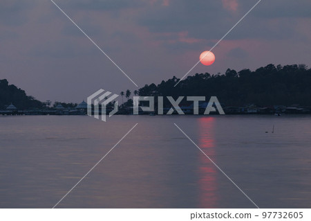 Sunset behind the rainforest, Koh Chang island, Thailand 97732605