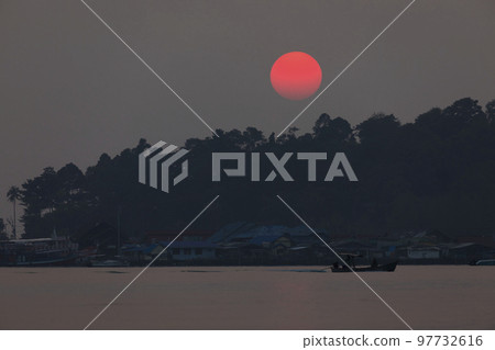 Sunset behind the rainforest, Koh Chang island, Thailand Sunset behind the rainforest, Koh Chang island, Thailand 97732616