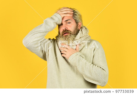 Immune response Bearded man sick. Warm scarf around neck. More than just symptom of illness. Hipster fever. Cold flu fever concept. Body temperature. Fever and thermal regulation of immunity Immune response Bearded man sick. Warm scarf around neck. More than just symptom of illness. Hipster fever. Cold flu fever concept. Body temperature. Fever and thermal regulation of immunity 97733039
