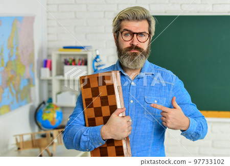 Chess club for students. Logic game for brain development. Chess in Classroom. game strategy analysis. checkmate. intelligent hobby. logic development. leisure school time. man pointing finger Chess club for students. Logic game for brain development. Chess in Classroom. game strategy analysis. checkmate. intelligent hobby. logic development. leisure school time. man pointing finger 97733102