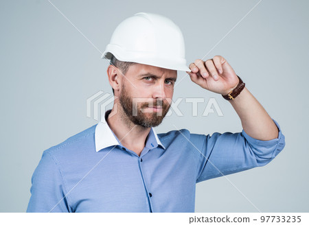 handsome smiling bearded businessman in helmet, business engineer handsome smiling bearded businessman in helmet, business engineer 97733235