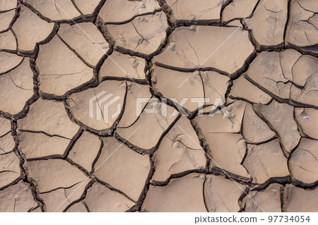 Cracked bottom of a dry reservoir, beautiful fractured texture Cracked bottom of a dry reservoir, beautiful fractured texture 97734054