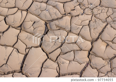 Cracked bottom of a dry reservoir, beautiful fractured texture 97734055