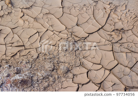 Cracked bottom of a dry reservoir, beautiful fractured texture 97734056