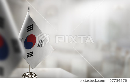Small flags of the South Korean on an abstract blurry background Small flags of the South Korean on an abstract blurry background 97734376