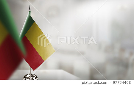 Small flags of the Benin on an abstract blurry background Small flags of the Benin on an abstract blurry background 97734408