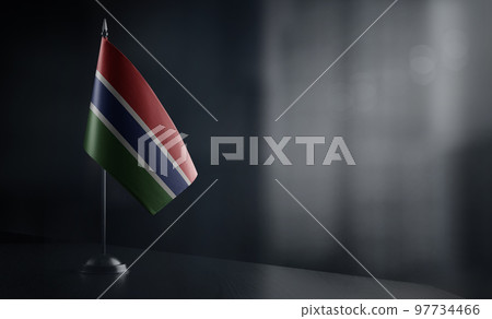 Small national flag of the Gambia on a black background 97734466
