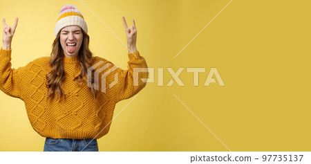 Awesome party rocks. Portrait amused carefree good-looking stylish girl having fun dancing dance floor heavy metal concert show rock-n-roll gesture show tongue rebellious close eyes enjoying music 97735137