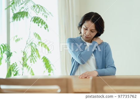 Middle woman with stiff shoulders 97735762