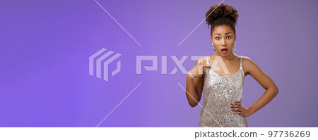 Insulted shocked concerned african-american woman complaining look offended pointing herself frustrated questioned look camera talking you standing shocked worried pose blue background Insulted shocked concerned african-american woman complaining look offended pointing herself frustrated questioned look camera talking you standing shocked worried pose blue background 97736269