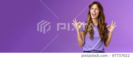 Got it relax everything perfect. Relaxed carefree curly girl winking cheeky smiling cunning show okay ok ring sign assure all good stand satisfied accepting great choice approving purple background Got it relax everything perfect. Relaxed carefree curly girl winking cheeky smiling cunning show okay ok ring sign assure all good stand satisfied accepting great choice approving purple background 97737022