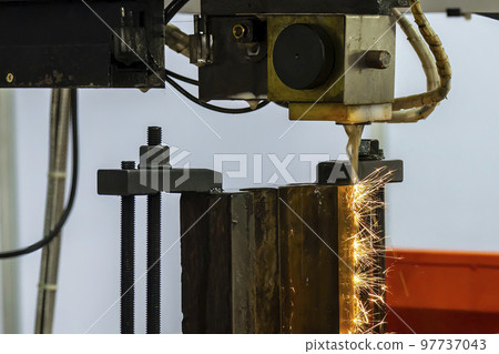 The wire EDM machine cutting the mold insert parts. The wire EDM machine cutting the mold insert parts. 97737043