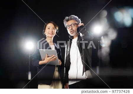 people working behind the scenes people working behind the scenes 97737426