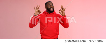 Guy promise perfection. Portrait confident charismatic pleasant african american man show okay no problem gesture say okay smiling assuring everything cool, standing pink background delighted 97737887
