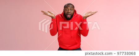 Excited passionate emotive african-american male discussing shocking match moment retelling amusing story cannot get clue how team lost shrugging hands spread sideways dismay look confused Excited passionate emotive african-american male discussing shocking match moment retelling amusing story cannot get clue how team lost shrugging hands spread sideways dismay look confused 97738068