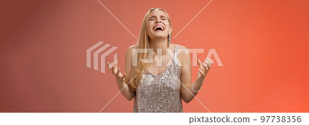 Relieved happy charming blond woman thank god shouting yes celebrating rejoicing win standing red background close eyes laughing happiness clench fists victory triumph gesture, dream came true Relieved happy charming blond woman thank god shouting yes celebrating rejoicing win standing red background close eyes laughing happiness clench fists victory triumph gesture, dream came true 97738356