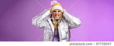 Angry ignorant outraged pissed blond female customer furious ripping hat head frowning make scary grimace lose temper yelling arguing have querrel standing distressed disappointed purple background 97739047