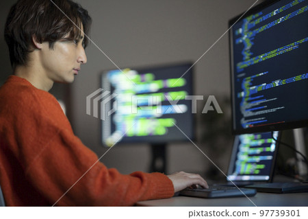 A young engineer working late at night Profile 97739301