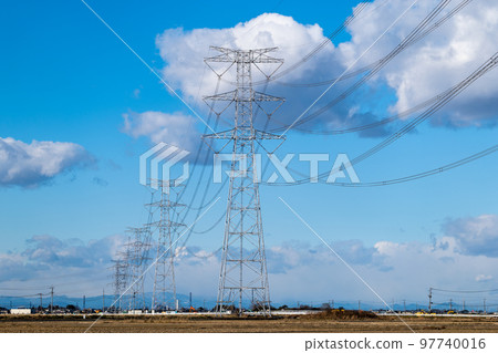 Power lines, blue sky and white clouds 97740016
