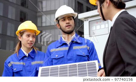 Engineers and businessman discussing about solar electrics. 97740156