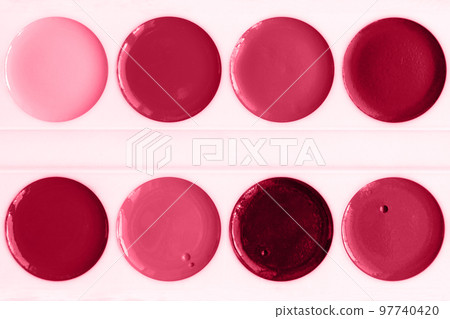 Trendy color of the year 2023. Palette watercolor paints and brush toned in viva magenta color. Trendy color of the year 2023. Palette watercolor paints and brush toned in viva magenta color. 97740420