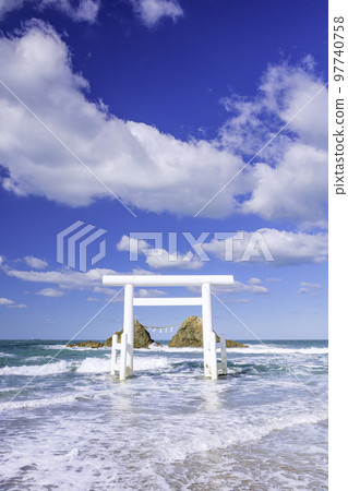 White torii gate and Meotoiwa in Futigaura, Itoshima City, Fukuoka Prefecture 97740758