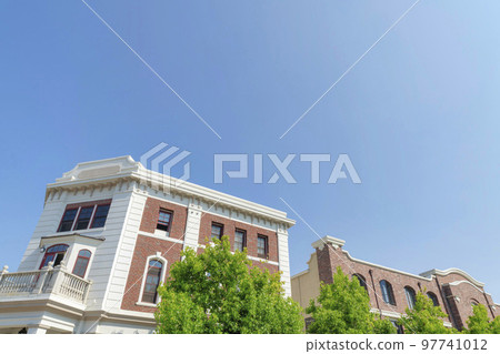 Two buildings with red bricks and white wall claddings at San Marcos, California 97741012