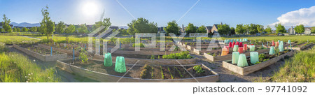 Public garden at the front of the residences at Daybreak in South Jordan, Utah 97741092